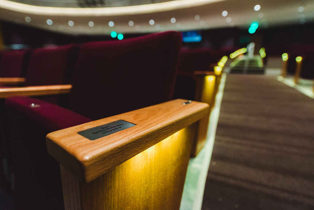 A close up shot of a seat in the Wilson Center performance hall